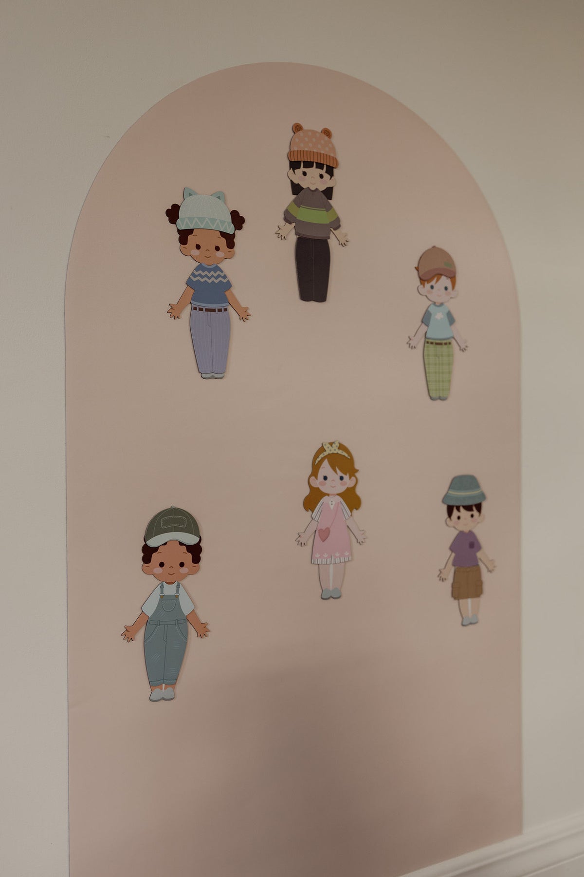 Dressables magnetic characters dressed in hats, tops and pants on the Isla Blush Wonder Arch