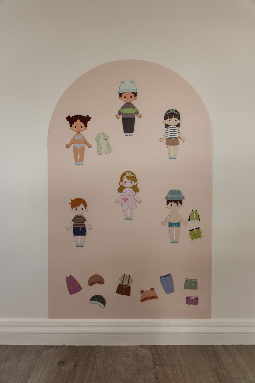Six Dressables magnetic characters with mix-and-match outfits on the Isla Blush Wonder Arch