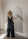 Toddler drawing with dust-free chalk on the Lily Sage Wonder Arch