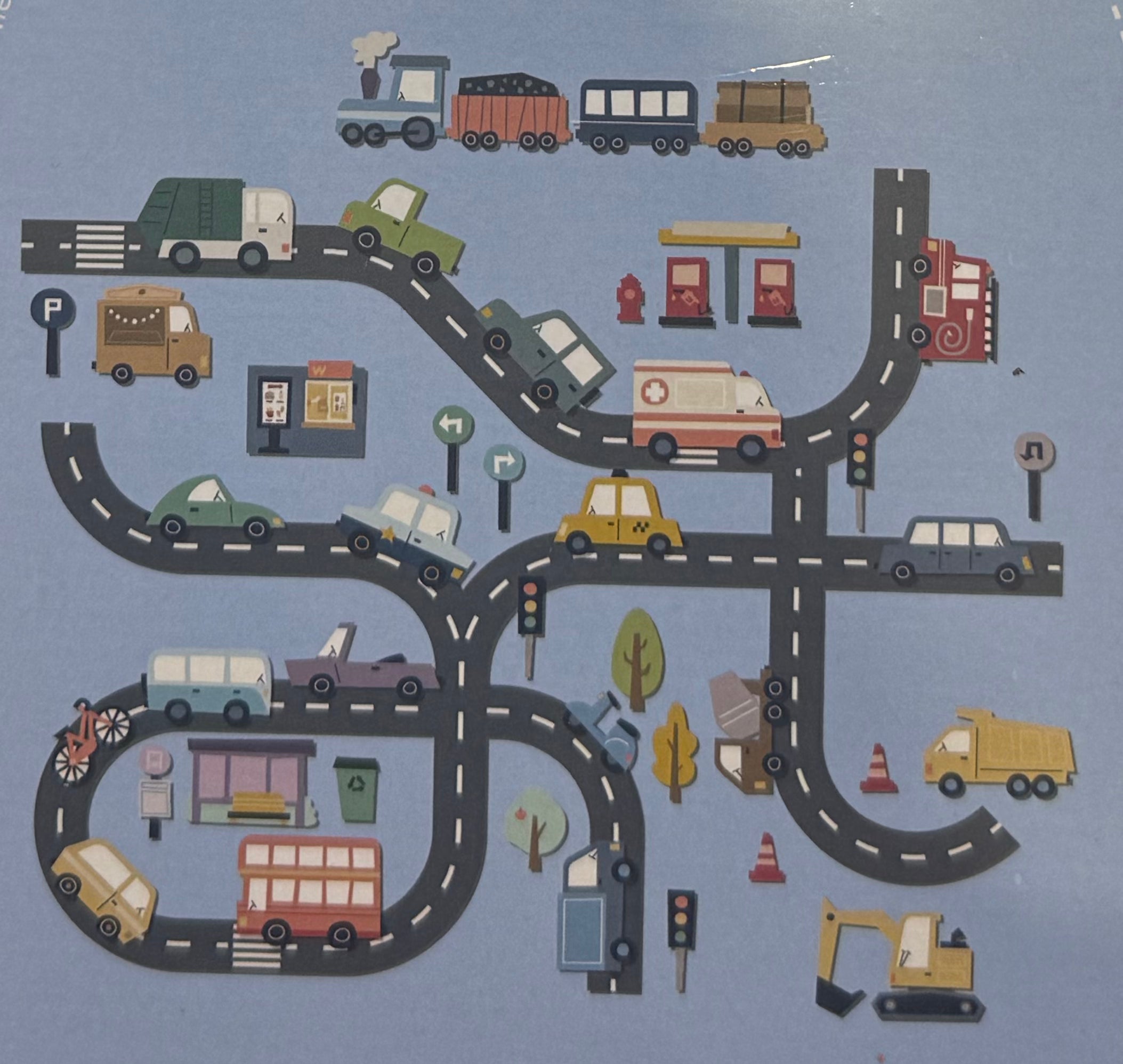 Every piece in the On The Road pack, including roads, cars, a train, petrol pumps and traffic lights